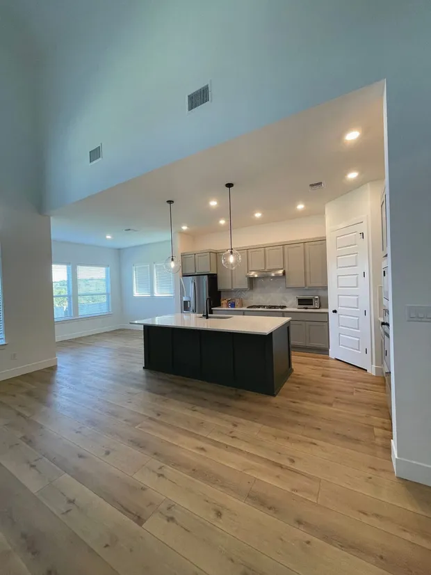 An open-plan kitchen and living area after a Kempt clean